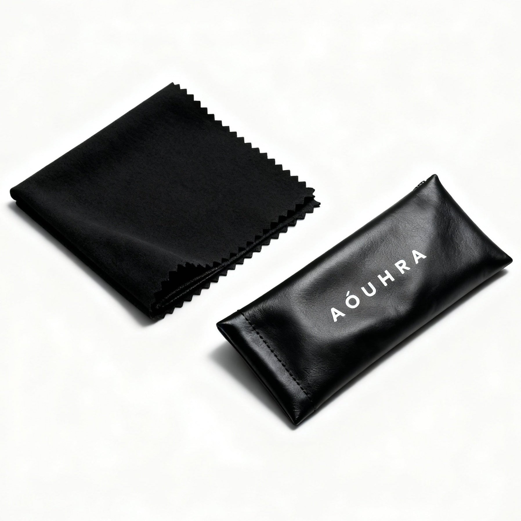 Black cleaning cloth and pouch with 'Aóuhra' branding on a white background