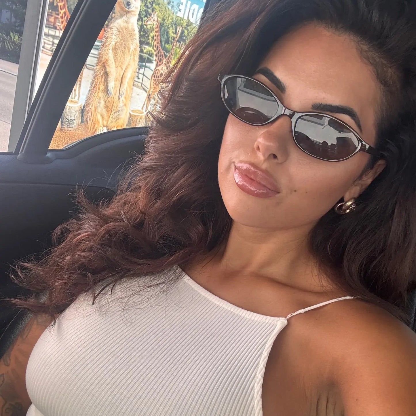 Muse Retro Oval Sunglasses - on-face lifestyle in car (R8)