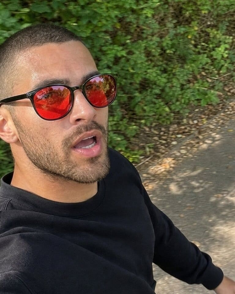 Red-lens glasses worn outdoors