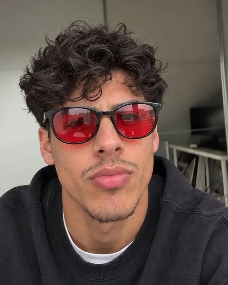 Red-lens glasses with a dark sweatshirt